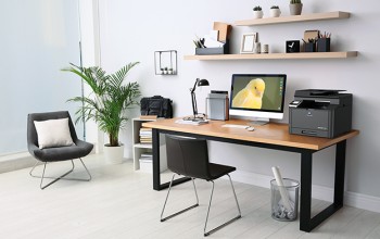 Modern computer on table in office interior. Stylish workplace